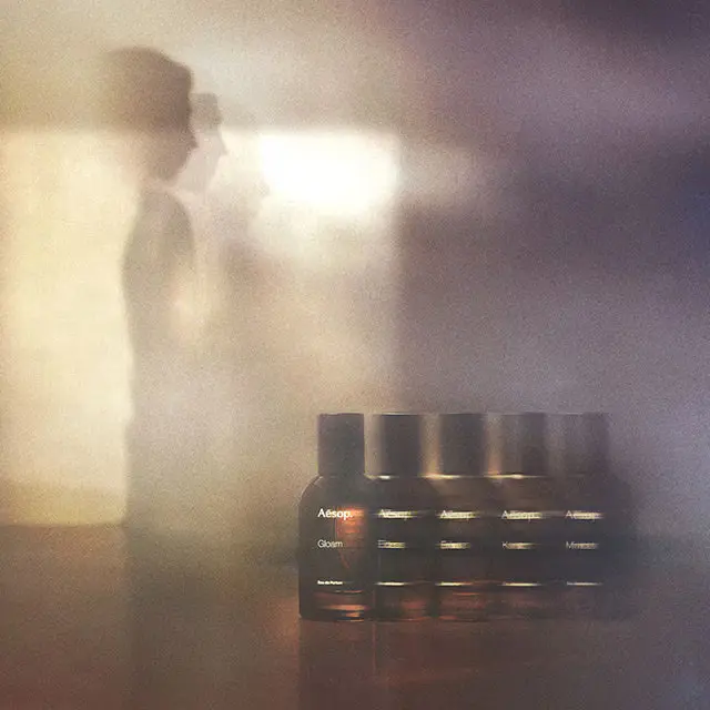 Line-up of glass amber bottles in the Othertopias fragrance range.