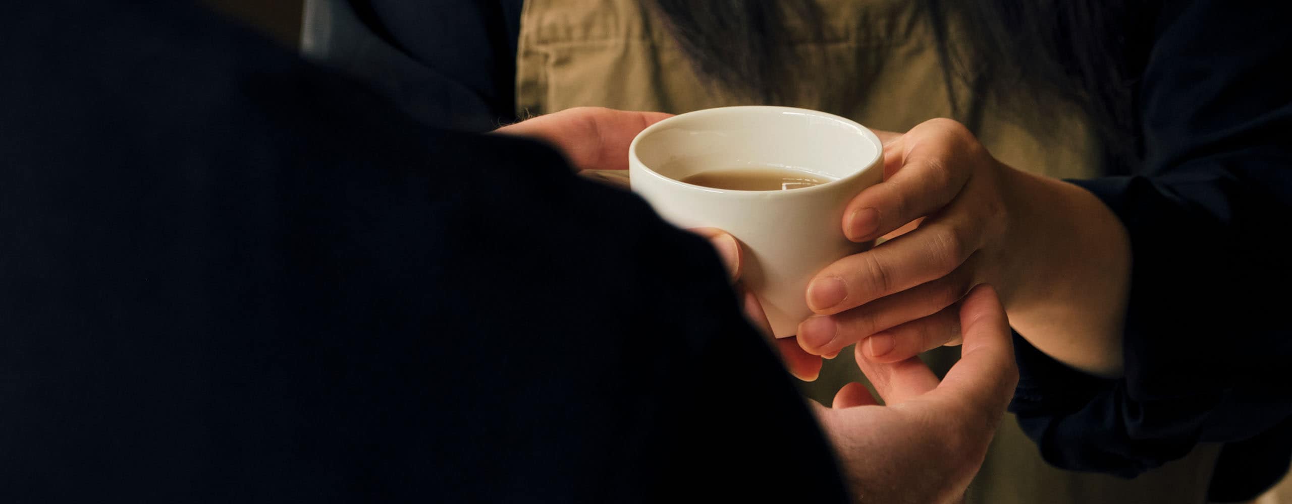 Aesop employees share a cup of tea